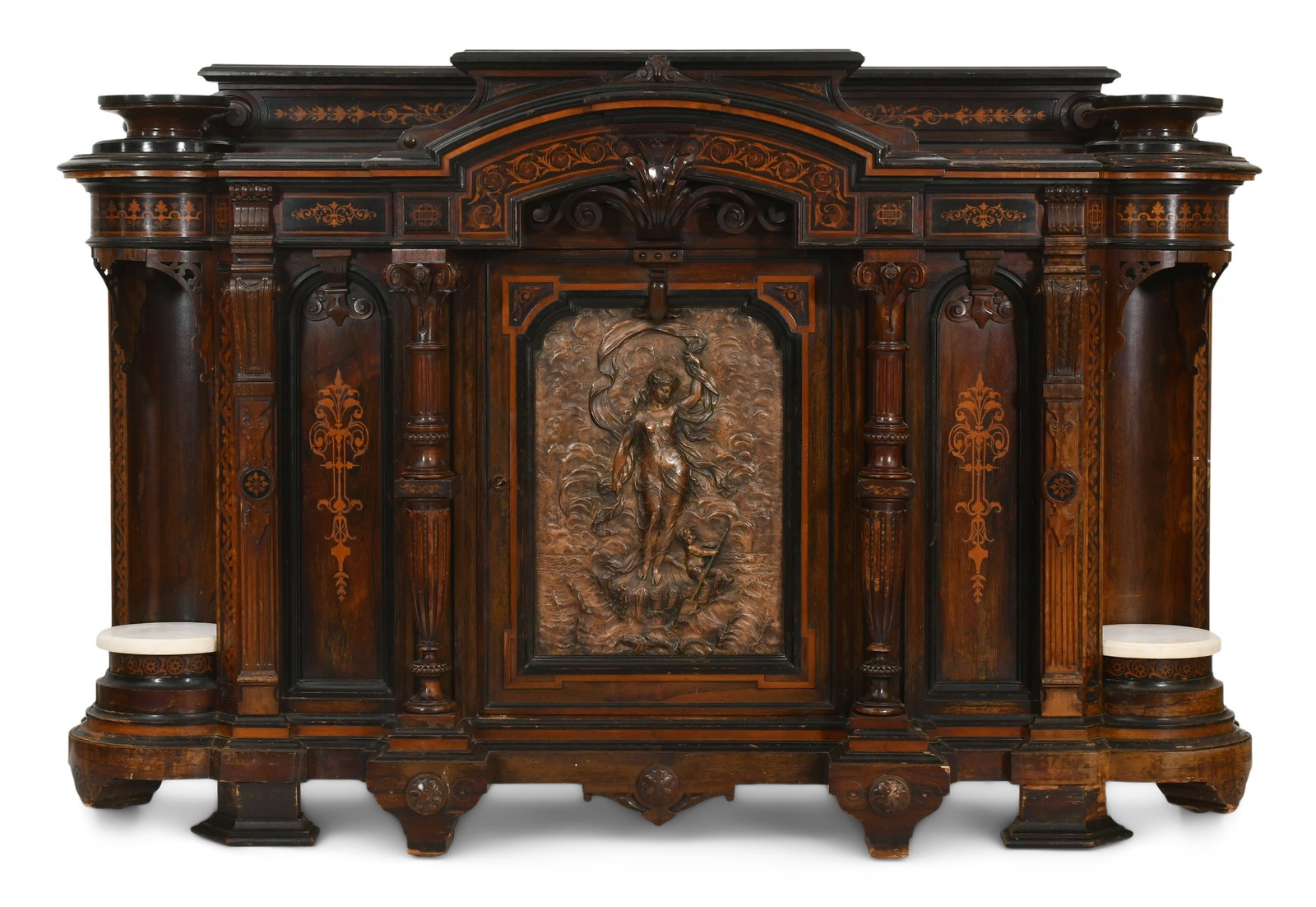 A Large American Renaissance Revival Inlaid, Ebonized, Parcel-Gilt, Bronze & Rosewood Credenza: A Large American Renaissance Revival Inlaid, Ebonized, Parcel-Gilt, Bronze & Rosewood Credenza circa 1870 the central door decorated with a bronze plaque of a robed female and putti emerging from a sh
