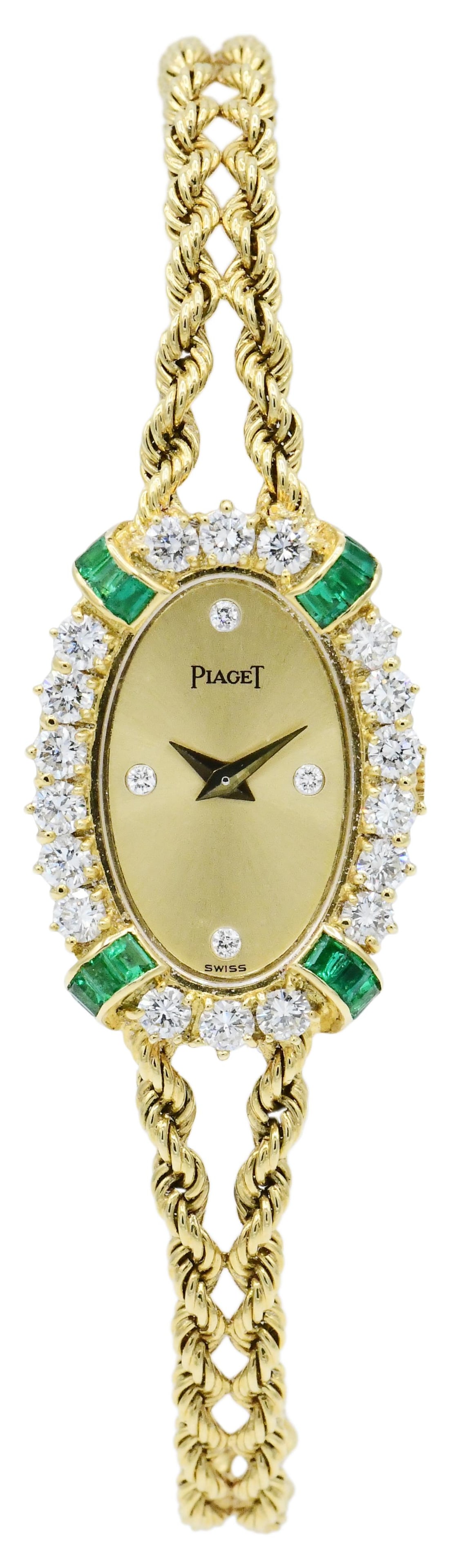 Piaget 18K Yellow Gold, Diamond & Emerald Wristwatch: Piaget 18K Yellow Gold, Diamond & Emerald Wristwatch • set with round brilliant diamonds weighing a total of 1.30 carats • accented by baguette emeralds weighing a total of 0.48 carats 