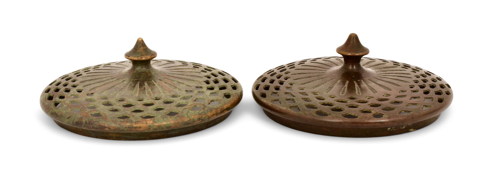 Tiffany Studios, Two Rare Slip Heat Caps: Tiffany Studios Two Rare Slip Heat Caps early 20th century patinated bronze 4 3/4 in. diameter Provenance: Property from an Important Northeast Collection Other Notes: Fontaine's Auction Gallery can