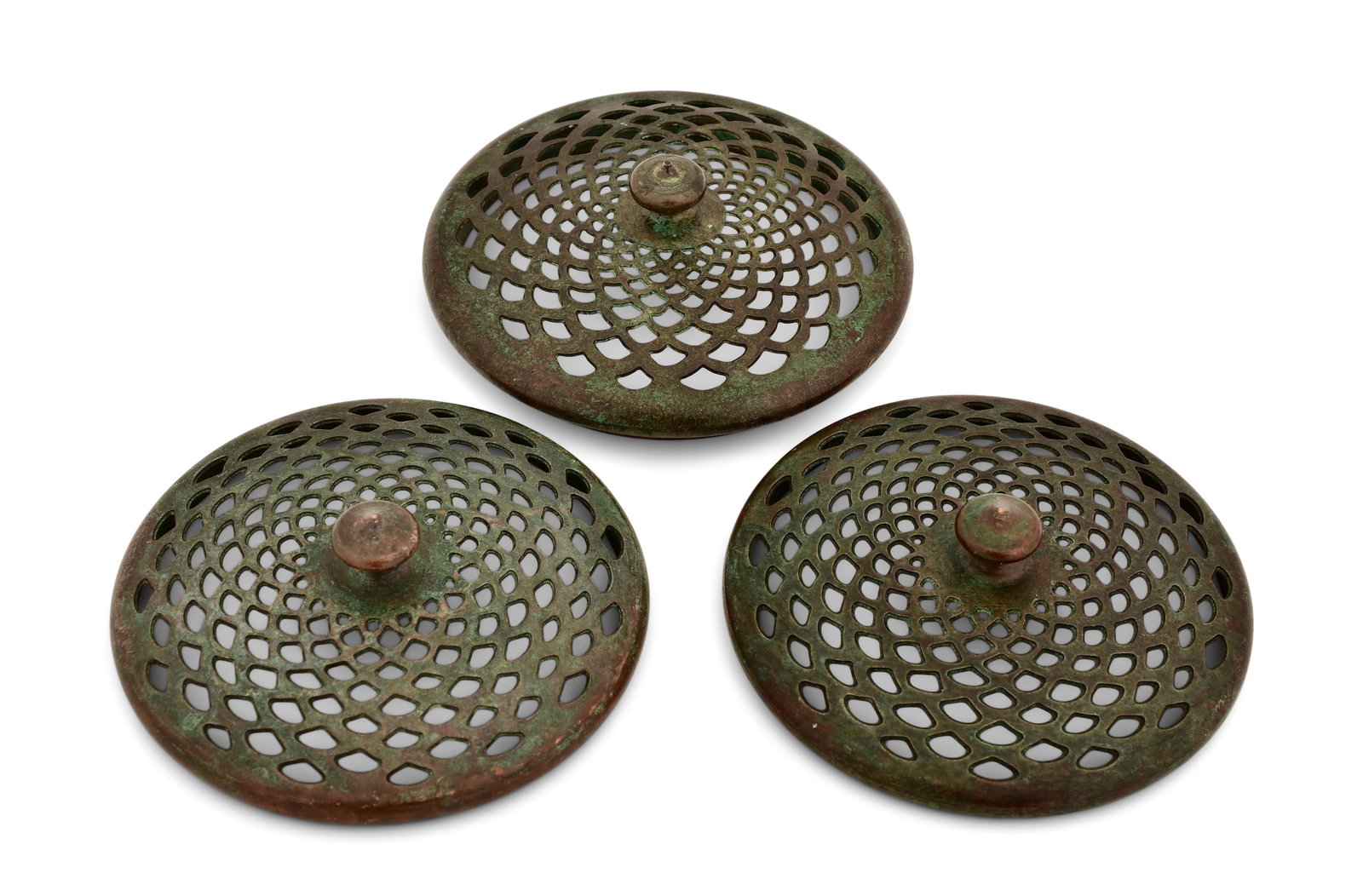 Tiffany Studios, Three Heat Caps: Tiffany Studios Three Heat Caps circa 1910 patinated bronze 3 3/4 in. diameter Provenance: Property from an Important Northeast Collection Other Notes: Fontaine's Auction Gallery can arrange shipping