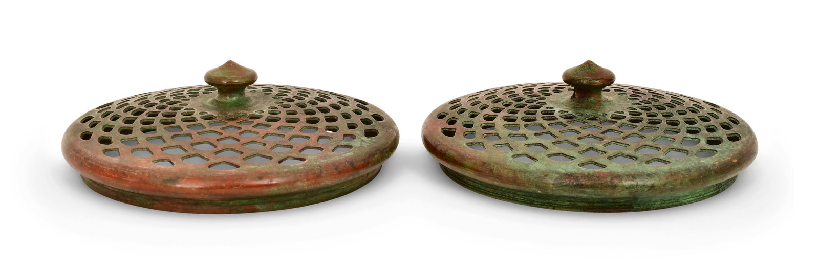 Tiffany Studios, Two Slip Heat Caps: Tiffany Studios Two Slip Heat Caps circa 1910 patinated bronze 3 3/4 in. diameter Provenance: Property from an Important Northeast Collection Other Notes: Fontaine's Auction Gallery can arrange