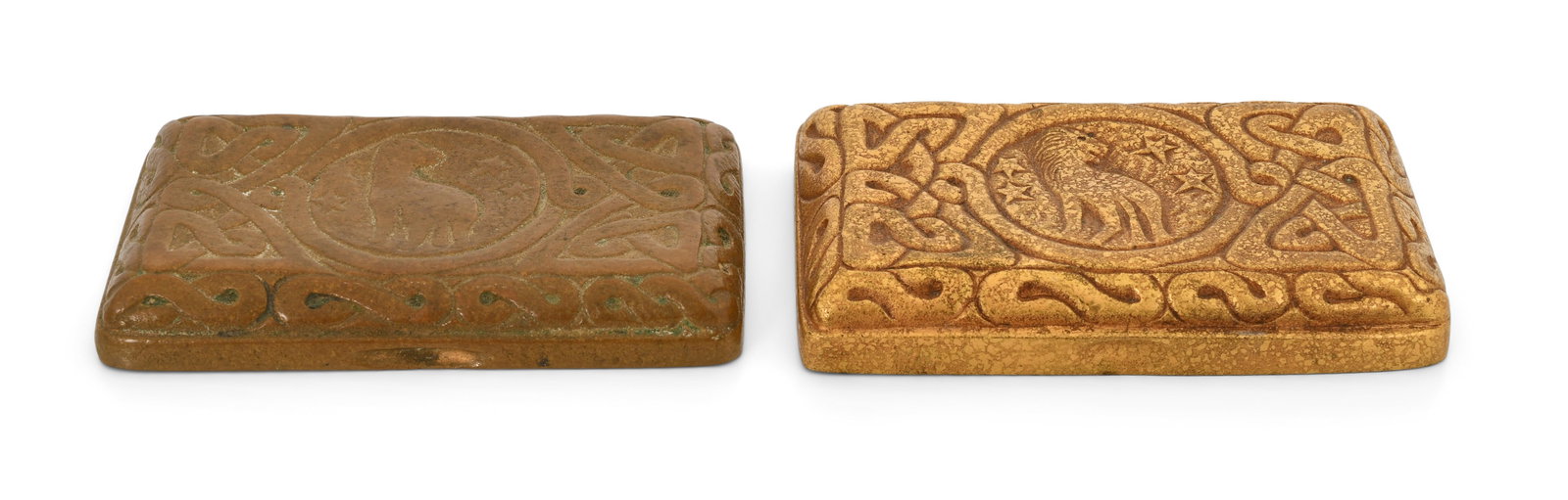 Tiffany Studios, Two "Zodiac" Paperweights: Tiffany Studios Two "Zodiac" Paperweights circa 1910 gilt bronze, patinated bronze each impressed "Tiffany Studios, New York, 934" 3 1/2 x 2 inches Provenance: Property from an Important Northeast