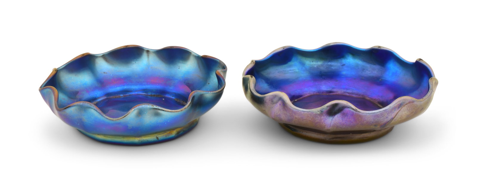 Tiffany Studios, Two Blue Favrile Glass Nut Dishes: Tiffany Studios Two Nut Dishes circa 1910 blue favrile glass each engraved "L.C.T. Favrile, X576" 1 1/4 x 4 1/4 inches Provenance: Private Collection, Massachusetts Other Notes: Fontaine's Auction