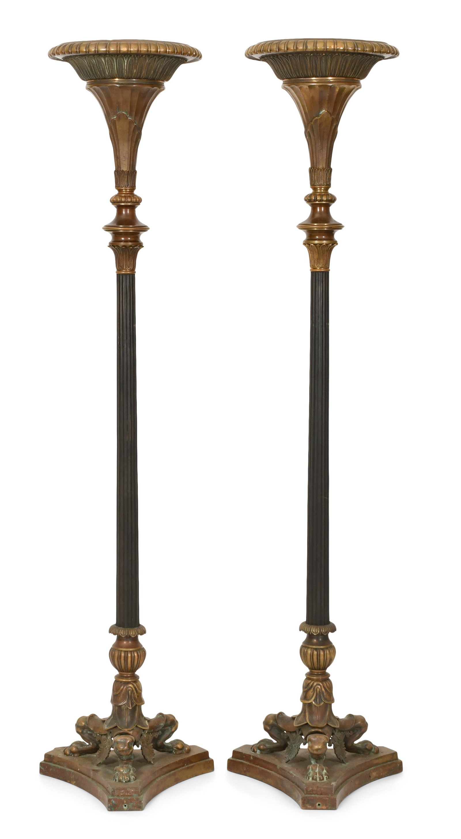 A Pair of Monumental Egyptian Revival Bronze Torchieres: A Pair of Monumental Egyptian Revival Bronze Torchieres late 19th century trumpeted leaf decorated tops with long fluted stems and tripod bases having claw feet 80 x 20 x 17 1/2 inches