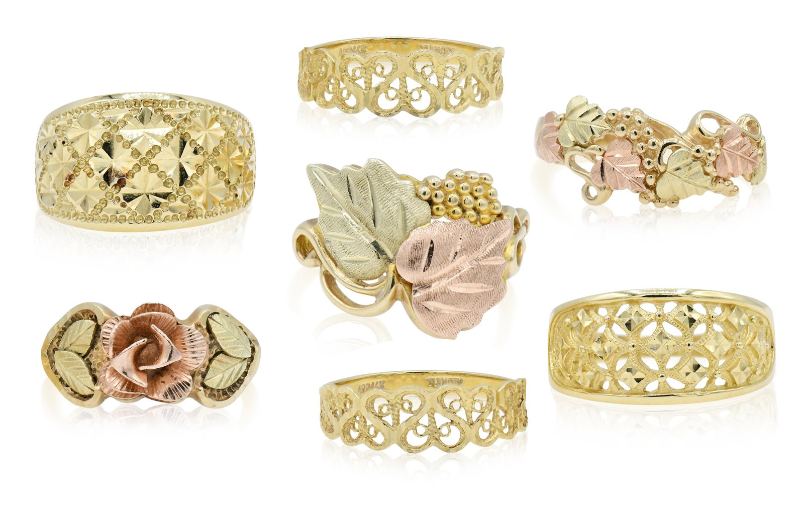 Group of Seven Gold Rings: Group of Seven Gold Rings • four 14K yellow gold rings • two 10K yellow & rose gold rings • one 10K yellow gold ring • 11 1/4 (largest ring size) • 15.9 dwt (total lot we