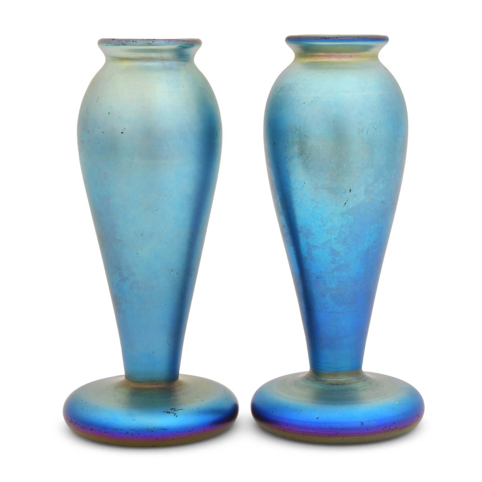 Pair of Quezal Art Glass Vases: Quezal Art Glass and Decorating Company (New York, 1901-1924) Pair of Vases circa 1915 iridescent glass each marked "Quezal" 7 x 3 3/4 inches Provenance: Private Collection, Massachusetts Othe