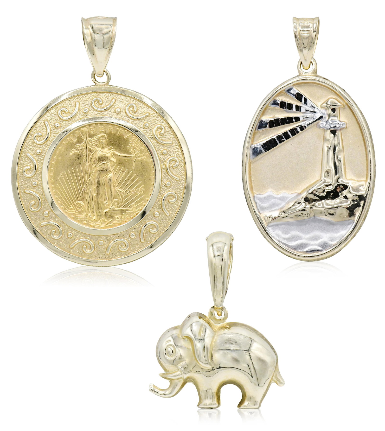 Three 14K Yellow Gold Pendants: Three 14K Yellow Gold Pendants • 2009 Liberty gold coin pendant, 1 7/16 inches (length) • Italian elephant pendant, 1 1/8 inches (length) • Michael Anthony lighthouse pendant, 1 5/16