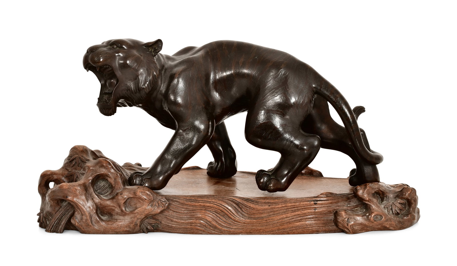 Japanese Meiji Period Bronze Sculpture of a Tiger: Japanese Meiji Period Bronze Sculpture of a Tiger early 20th century with a carved wood base 8 x 15 x 6 1/2 inches Provenance: Private Collection, Massachusetts