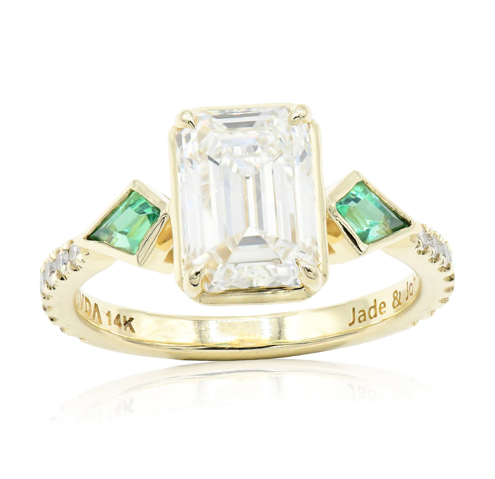 Javda 14K Yellow Gold, 2.50 Carat Diamond & Emerald Ring: Javda 14K Yellow Gold, 2.50 Carat Diamond & Emerald Ring • featuring a 2.50 carat emerald cut diamond with VS1 clarity, I color and Faint fluorescence • flanked by kite shaped emeralds