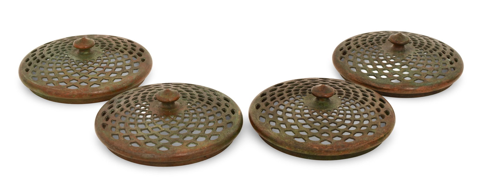 Tiffany Studios, Four Slip Heat Caps: Tiffany Studios Four Slip Heat Caps circa 1910 patinated bronze 4 in. diameter Provenance: Important Private Collection Other Notes: Fontaine's Auction Gallery can arrange shipping for this item (USA