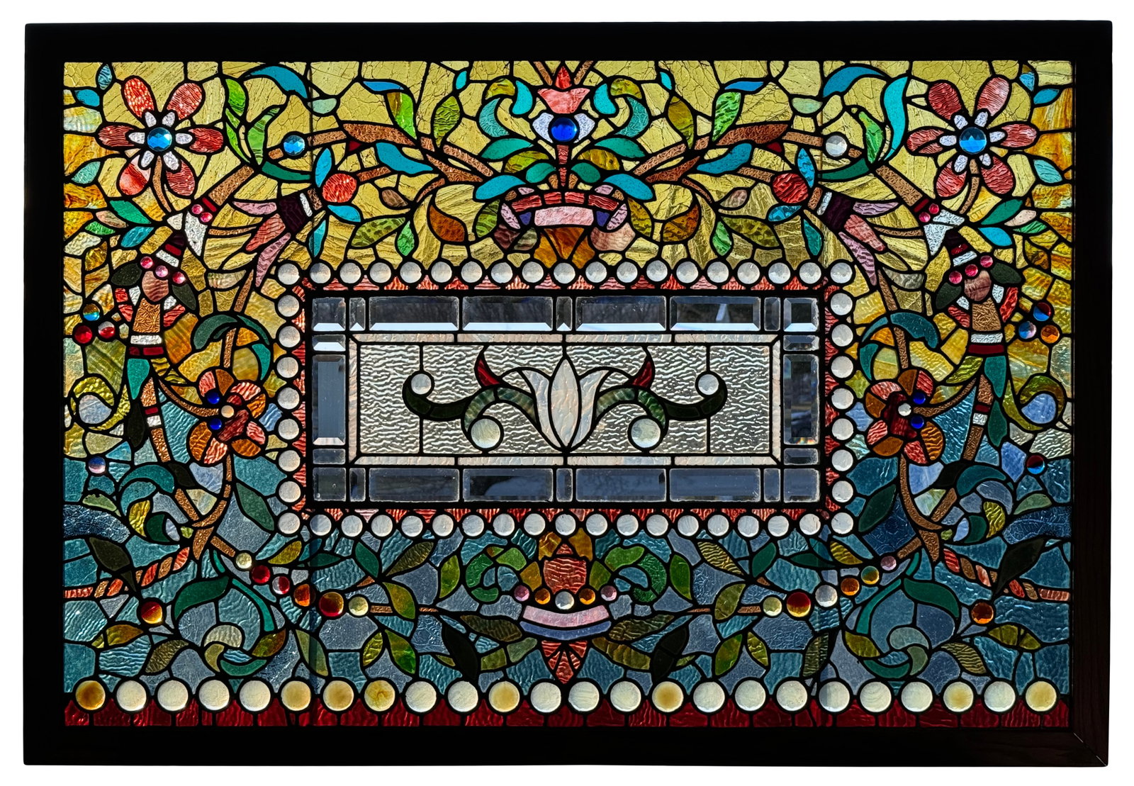 American Jeweled & Leaded Glass Window: American Jeweled & Leaded Glass Window early 20th century the window decorated with flowers, foliate, "jeweled" glass and geometric panels 40 x 58 inches (frame) 35 3/4 x 53 3/4 inches (excluding fram
