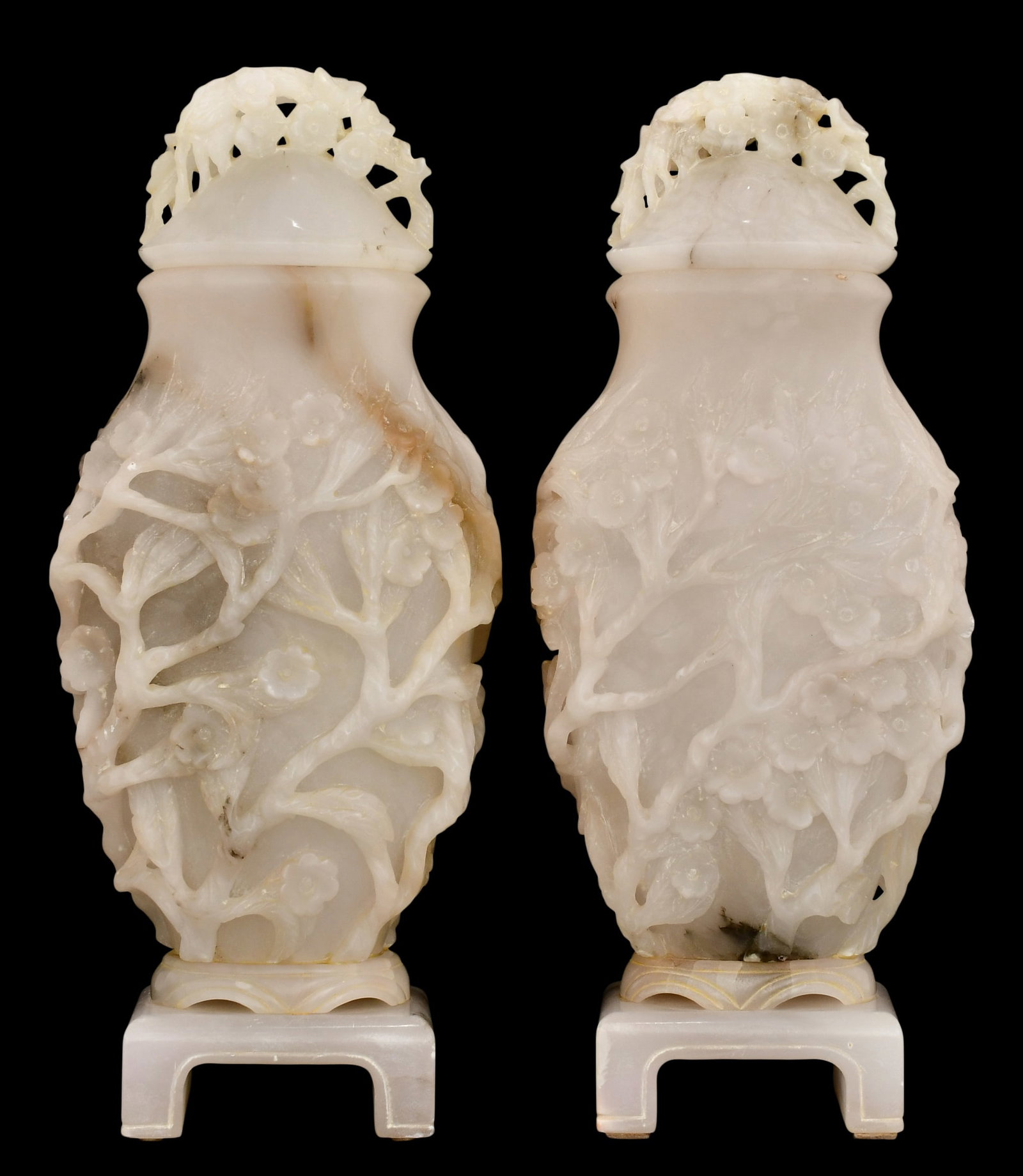 A Pair of Large Chinese Carved Alabaster Urns: A Pair of Large Chinese Carved Alabaster Urns early 20th century 24 x 9 x 6 inches Provenance: Private Collection, New York