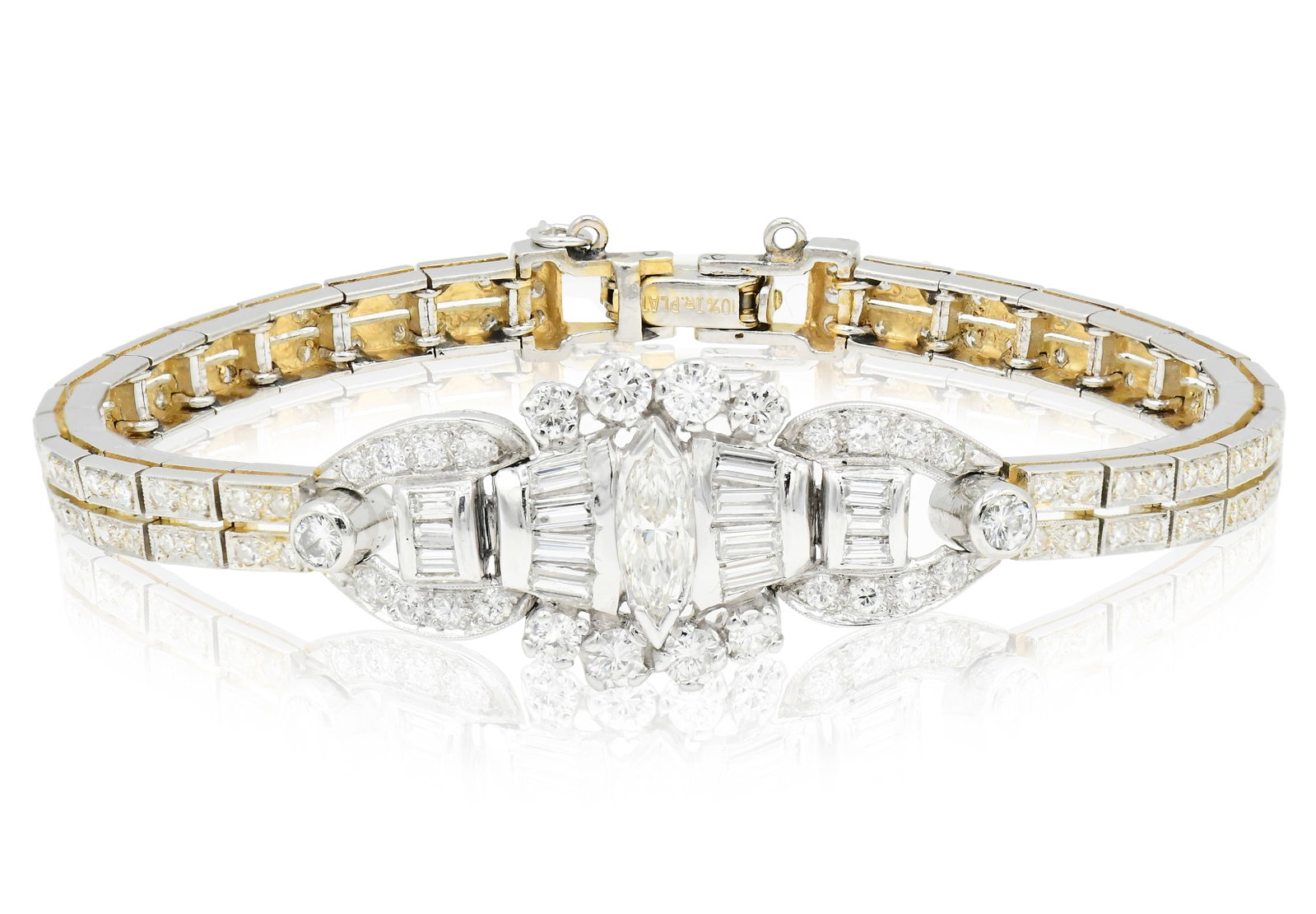 Platinum & 3.86 Carat Diamond Bracelet: Platinum & 3.86 Carat Diamond Bracelet • featuring a 1.07 carat marquise cut diamond • accented by baguette and tapered baguette diamonds weighing a total of 0.60 carats • set