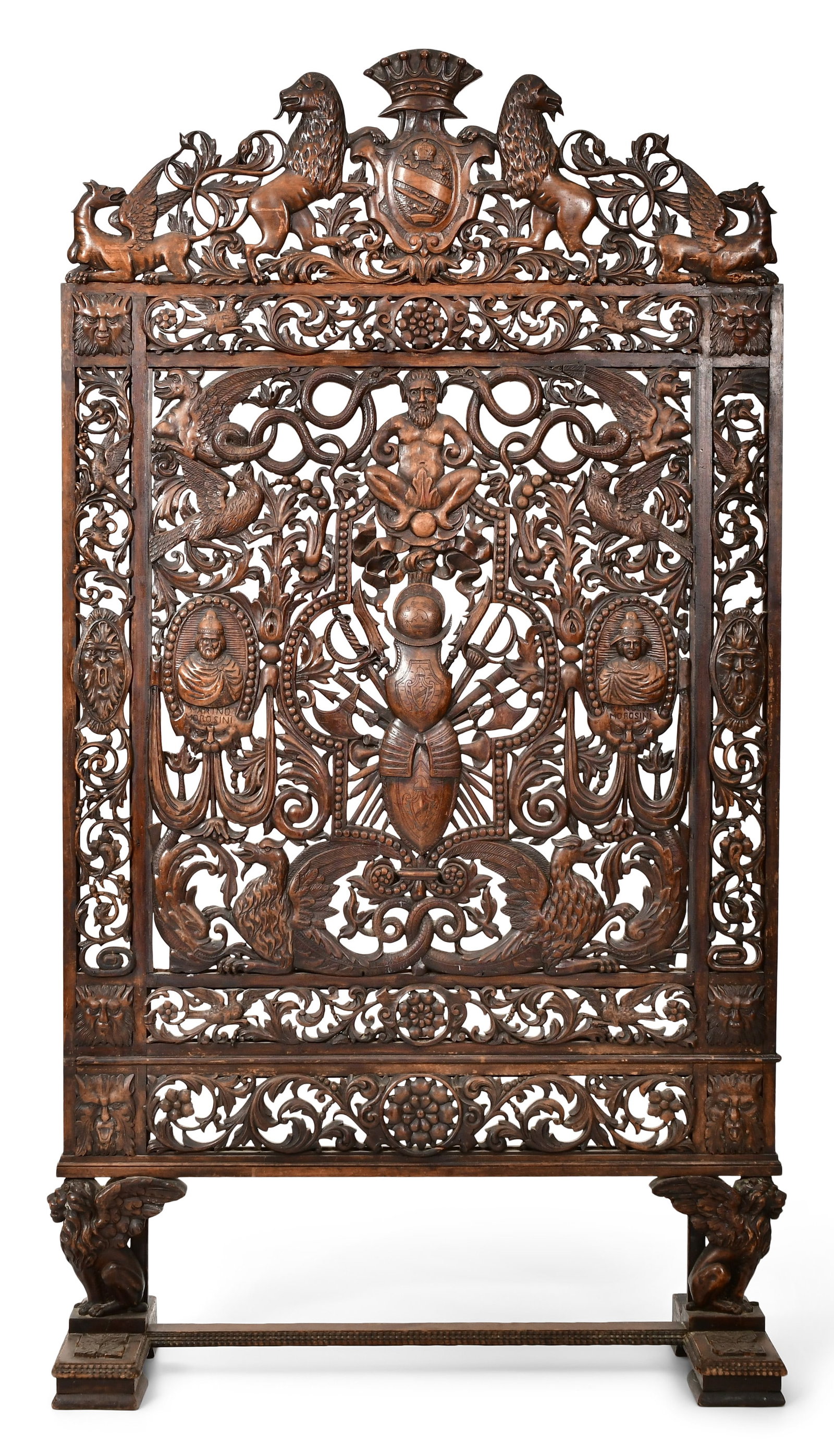 Continental Figural Carved Walnut Fireplace Screen: Continental Figural Carved Walnut Fireplace Screen late 19th century elaborately carved with lions, dragons, serpents, figures, armor, cartouche shields and foliate 74 1/2 x 39 1/2 x 15 1/4 inches