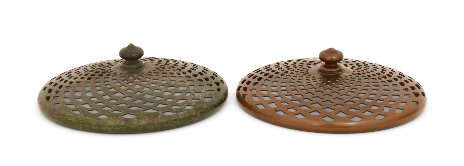Tiffany Studios Two Heat Caps: Tiffany Studios Two Heat Caps circa 1910 patinated bronze 4 1/2 in. diameter Provenance: Property from a Massachusetts Collector Other Notes: Fontaine's Auction Gallery can arrange shipping for this i
