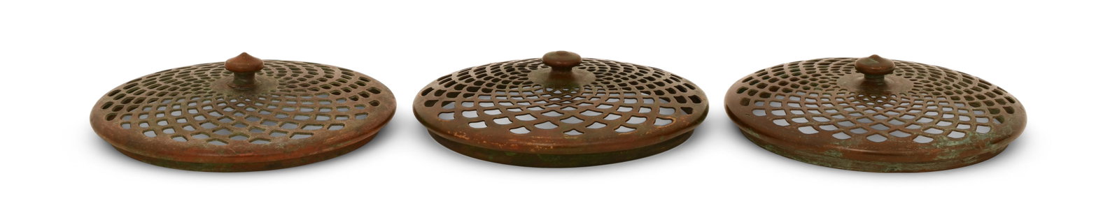 Tiffany Studios, Three Slip Heat Caps: Tiffany Studios Three Slip Heat Caps circa 1910 patinated bronze 4 1/2 in. diameter Provenance: Important Private Collection Other Notes: Fontaine's Auction Gallery can arrange shipping for this item 