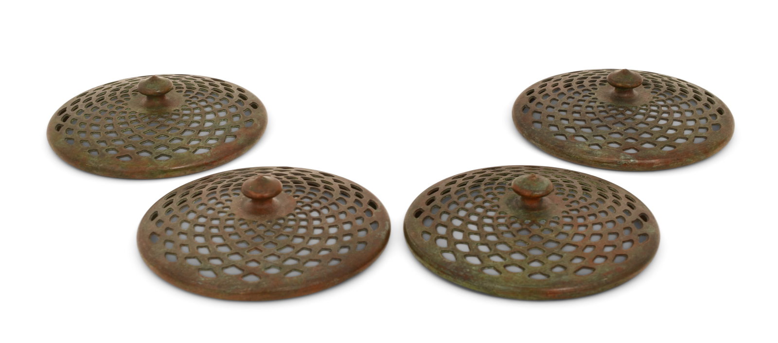 Tiffany Studios, Four Heat Caps: Tiffany Studios Four Heat Caps circa 1910 patinated bronze 4 in. diameter Provenance: Important Private Collection Other Notes: Fontaine's Auction Gallery can arrange shipping for this item (USA only)