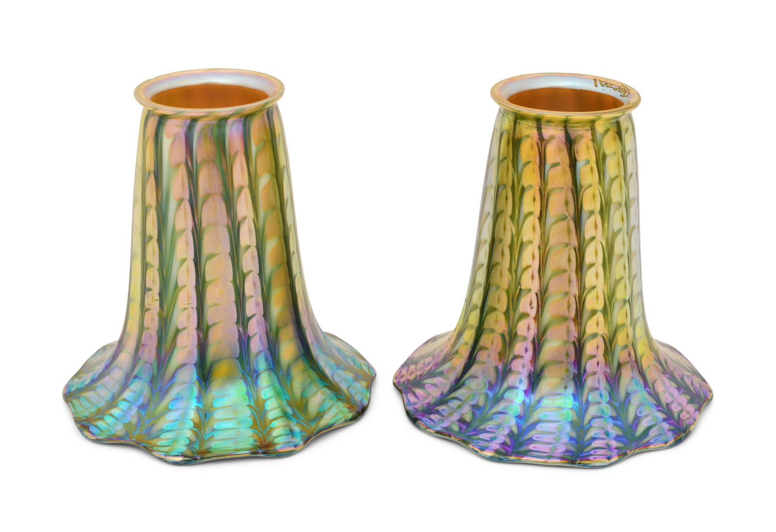 Pair of Quezal Art Glass Decorated Shades: Quezal Art Glass and Decorating Company (New York, 1901-1924) Pair of Decorated Shades circa 1915 iridescent glass each marked "Quezal" 5 x 5 inches Provenance: Private Collection, Tennessee