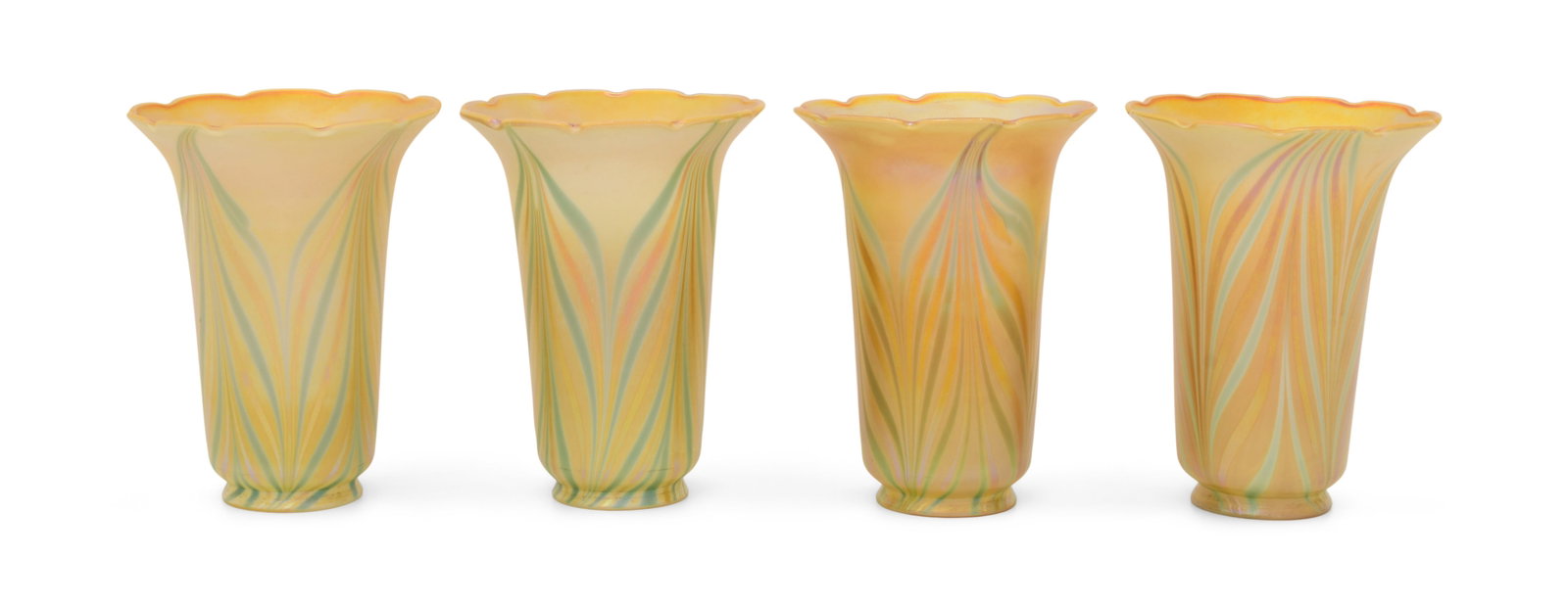 Set of Four Quezal Art Glass Decorated Shades: Quezal Art Glass and Decorating Company (New York, 1901-1924) Set of Four Decorated Shades circa 1915 iridescent glass each marked "Quezal" 6 x 5 inches Provenance: Private Collection, Tennessee