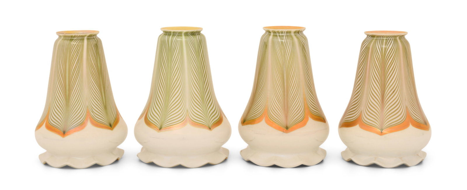 Set of Four Attr. Quezal Art Glass "Pulled Feather" Shades: Attr. Quezal Art Glass and Decorating Company (New York, 1901-1924) Set of Four "Pulled Feather" Shades circa 1915 iridescent glass unsigned 6 x 5 inches Provenance: Private Collection, Tennessee