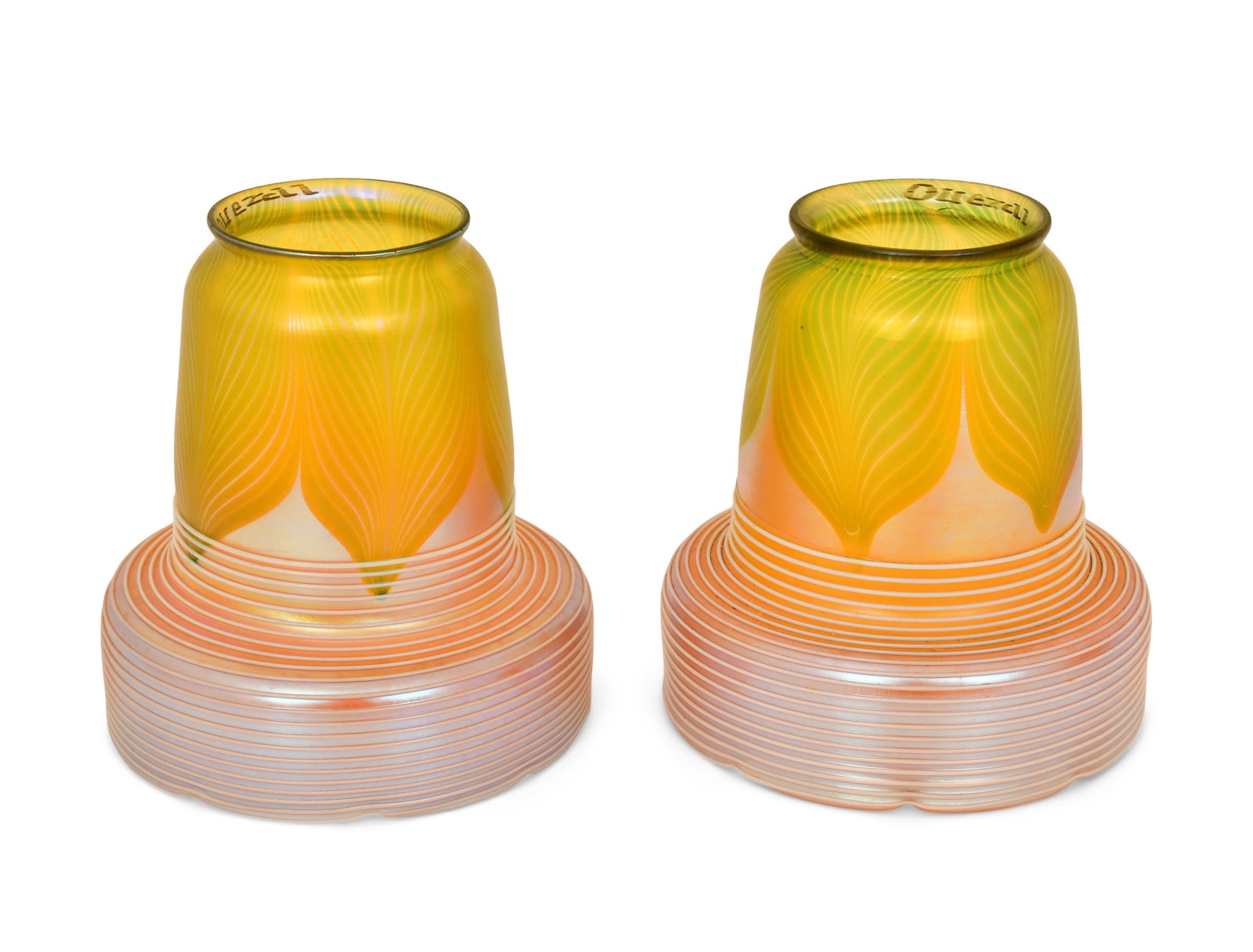 Pair of Quezal Art Glass Decorated Shades: Quezal Art Glass and Decorating Company (New York, 1901-1924) Pair of Decorated Shades circa 1915 iridescent glass each marked "Quezal" 4 1/2 x 4 1/2 inches Provenance: Private Collection, Tennessee