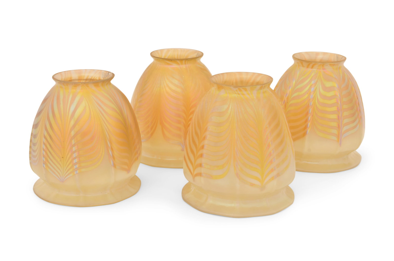 Four Steuben Glass "Pulled Feather" Shades: Steuben Glass Works (Corning, New York, est. 1930) Four "Pulled Feather" Shades early 20th century iridescent glass each signed with fleur-de-lis mark 4 1/2 x 4 1/2 inches Provenance: Private