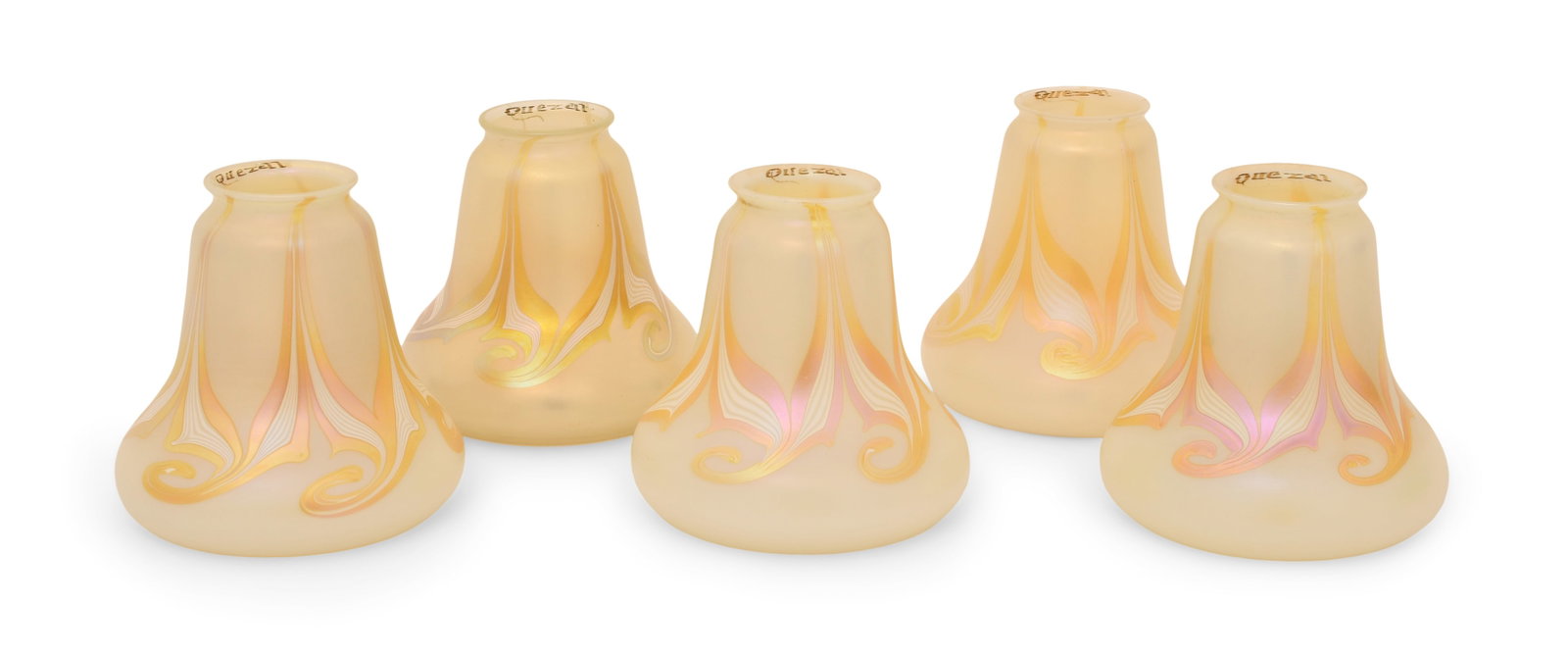 Five Quezal Art Glass Decorated Shades: Quezal Art Glass and Decorating Company (New York, 1901-1924) Five Decorated Shades circa 1915 iridescent glass each marked "Quezal" 5 1/2 x 5 1/2 inches Provenance: Private Collection, Tennessee