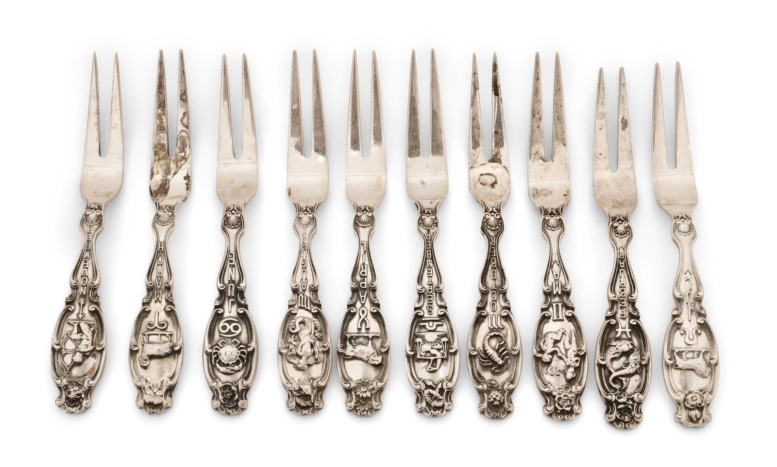 Set of 12 Gorham Sterling Silver "Zodiac" Cocktail Forks: Gorham Mfg. Co. Set of 12 "Zodiac" Cocktail Forks early 20th century sterling silver marked "(lion-anchor-G), Sterling, Pat. Oct. 9, 1894" 3 3/4 in. long Provenance: Private Collection, New York Ot