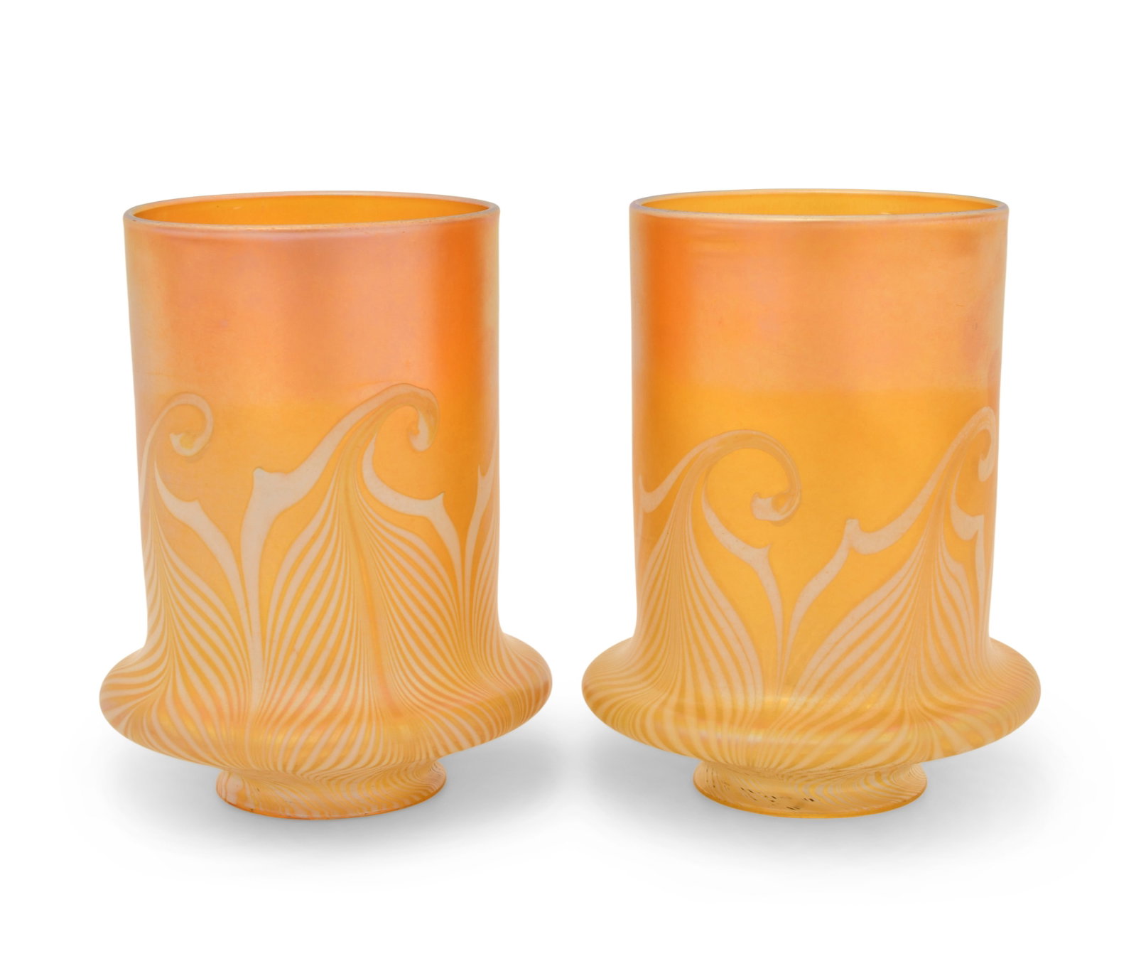 Pair of Quezal Art Glass Decorated Shades: Quezal Art Glass and Decorating Company (New York, 1901-1924) Pair of Decorated Shades circa 1915 iridescent glass each marked "Quezal" 5 x 4 inches Provenance: Private Collection, Tennessee