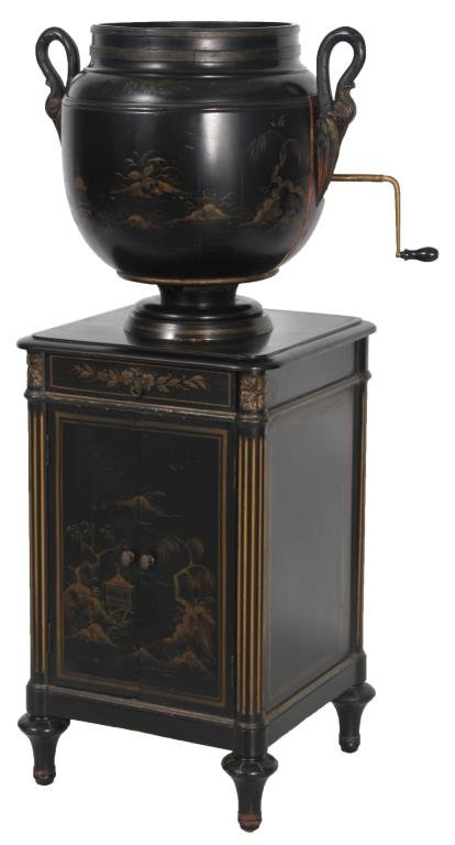 The Oxford Urn Shaped Phonograph: The Oxford Urn Shaped Phonograph.The phonograph body has an urn form with carved stork handles on the side and hinged lid; under the lid is the turn table and brass tone arm feeding into the lower bow