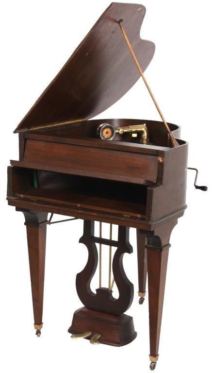 Brunswick Baby Grand Phonograph: Brunswick Balke Collender Company mahogany baby grand piano phonograph. The case is in the form of a baby grand piano with square tapered legs and central lyre with brass foot petals; under the lid is