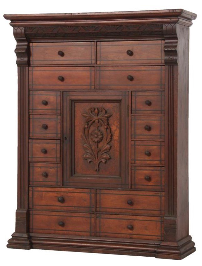 Carved Walnut 16 Dr. Apothecary Cabinet: Carved Walnut 16 Drawer Apothecary Cabinet. Wall hanging cabinet has an overhanging top with stylized floral carved frieze and long pilasters on the sides, 2 drawers over 2 drawers at the top, 2 drawe