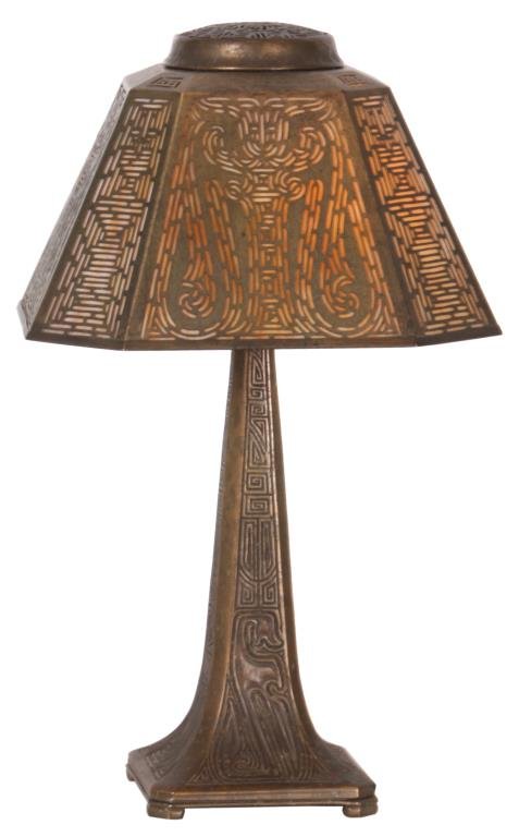 Tiffany Studios Chinese Pattern Desk Lamp: Tiffany Studios "Chinese Pattern" Desk Lamp. 10 in. shade has a pyramidal form with chamfered corners, reticulated overlays on each side in the Chinese pattern over caramel glass, shade is signed and 