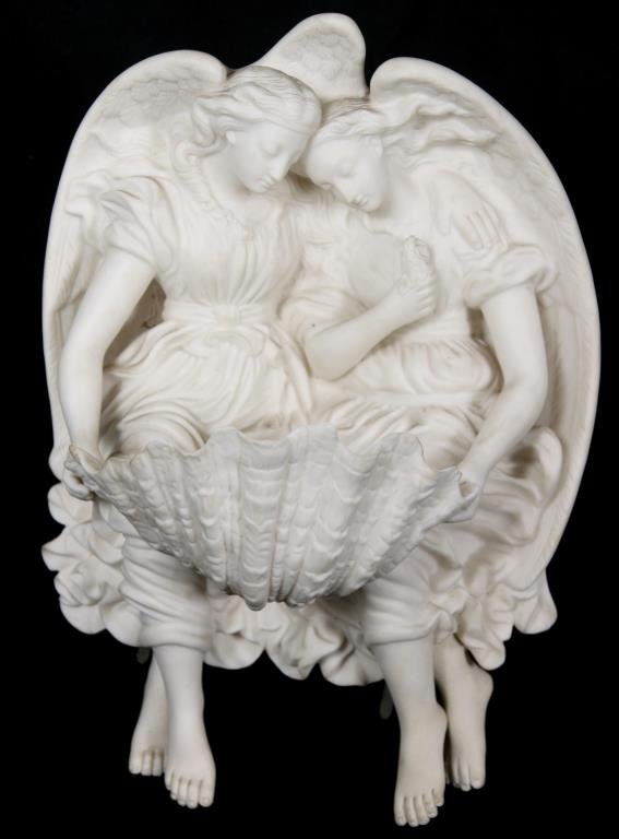 Parian Figural Holy Water Well: Parian Figural Holy Water Well. A pair of female winged angels are seated side by side, one has her arm around the other, they both hold between them a large clam shell, acting as a bowl and their fee