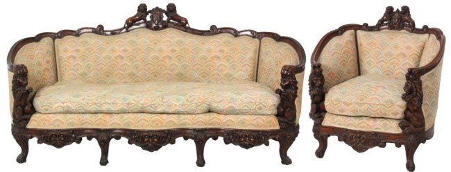 2 Pc. Lion Carved Walnut Parlor Set: 2 Pc. Lion Carved Walnut Parlor Set. Crests have a carved shield in the center with figural lions on either side, filigree carved crest-rails continuing through the arms with claw foot carvings at the