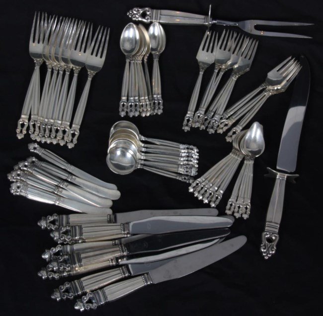 58 Pc. Georg Jensen Sterling Flatware: 58 Pc. Georg Jensen Sterling Flatware. The acorn pattern set has long fluted handles with double S-scrolls and acorns at the ends. Has 8 hollowware spreaders, 8 hollowware knives, 8 dinner forks, 8 te