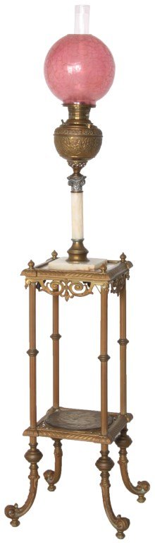 Brass & Onyx Piano Floor Lamp: Brass & Onyx Piano Floor Lamp. Repousse brass font on a white onyx stem over an inset stepped platform; has brass framing with finials at the corners, curled feet and a lower tier with round nouveau f