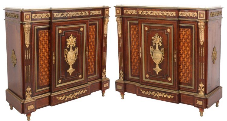 Pr. French Rosewood Marble Top Credenzas: Pr. French Rosewood Marble Top Credenzas. White marble top has a block front bordered with bronze trim, inset ormolu bronze filigree mounts, bronze capitols on the ends, urn design on the front panel