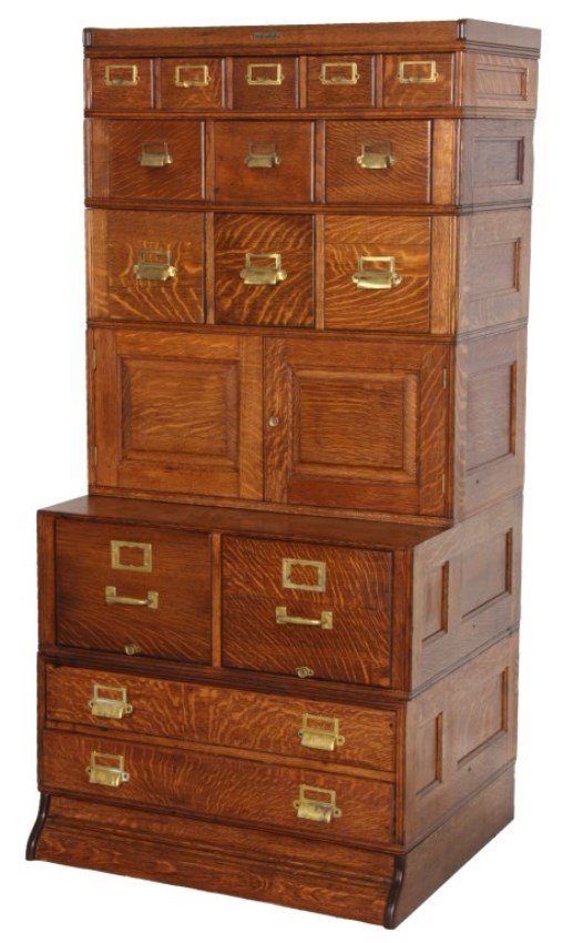 Yawman & Erbe Oak Sectional File Cabinet: Yawman & Erbe Oak Stacking Sectional File Cabinet. Cabinet has a section with 2 full length drawers at the bottom, brass pulls and index frames, 2 drawer file cabinet section, a single 2 door cabinet