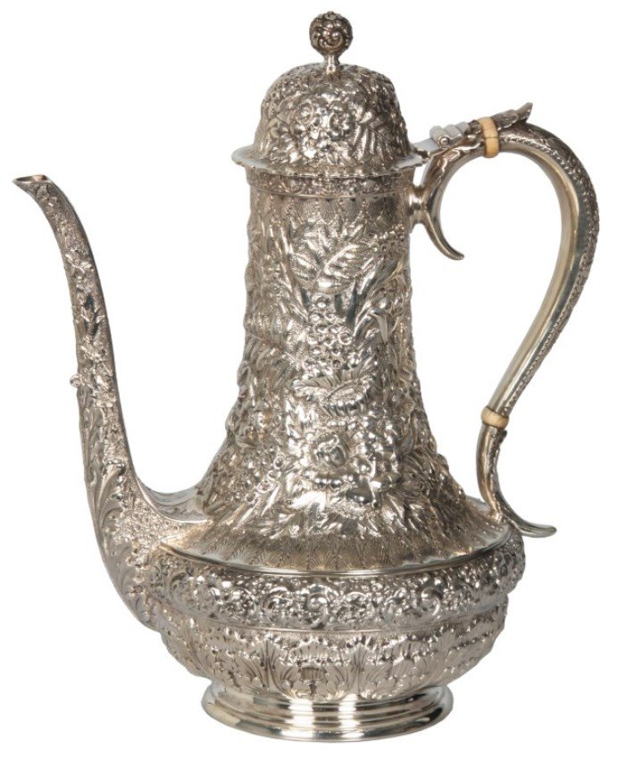 Tiffany Repousse Sterling Silver Tea Pot: Tiffany & Co. Makers Repousse Sterling Silver Tea Pot. Beautiful heavy repousse design with summer flowers, ferns & leaf decoration with an S-shaped handle, hinged domical lid and spherical finial. Si