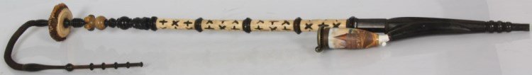 Carved Antler, Ebony & Porcelain Pipe: Carved Antler, Ebony & Porcelain Pipe. stem measures 41 in. long plus a 19 in. tube and mouthpiece totaling 60 in. has a 4 section grip pierced carved in antler with quatrefoil patterns on a carved eb