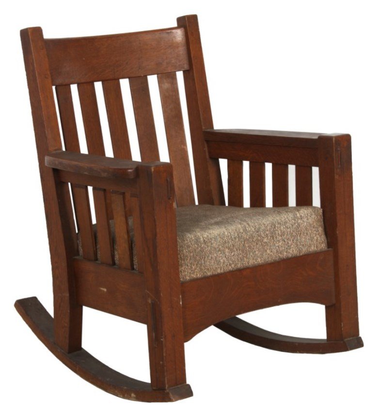 Harden Even Arm Rocker: Harden Even Arm Rocker. Oak Arts & Crafts rocking chair with 5 slat back, 4 slats under the arms, arched seat rail. Has a partial furniture label, light brown overcoated finish and reupholstered seat,