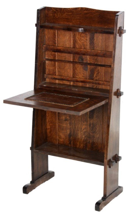 Gustav Stickley No. 505 Oak Chalet Desk: Gustav Stickley No. 505 Oak Chalet Desk. The desk has a tall gallery top with a slanted front design and shoe foot base, lower shelf and keyed through tenon construction; the drop front writing surfac