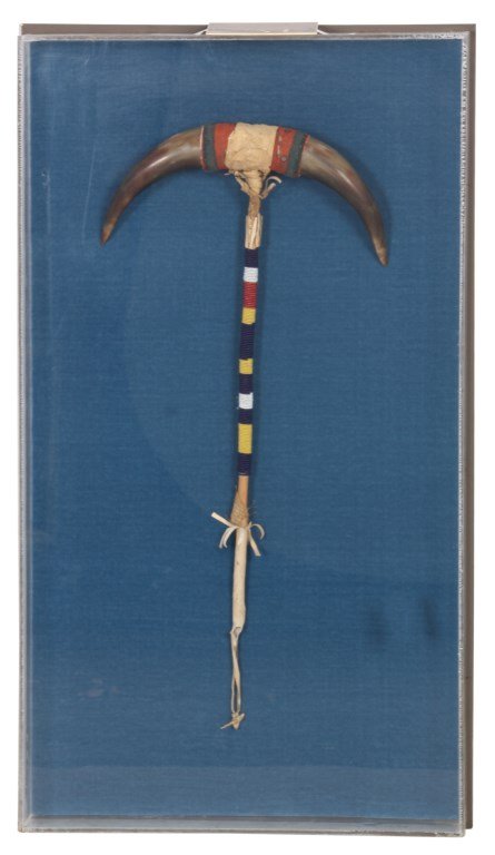 Native American Double Horn Club: Native American Double Horn Club, c. 1900. Long wood shaft is tightly wrapped with a colorful beaded grip; has pointed cattle horns on the striking end. Framed and protected in a plexiglass case. 33 i