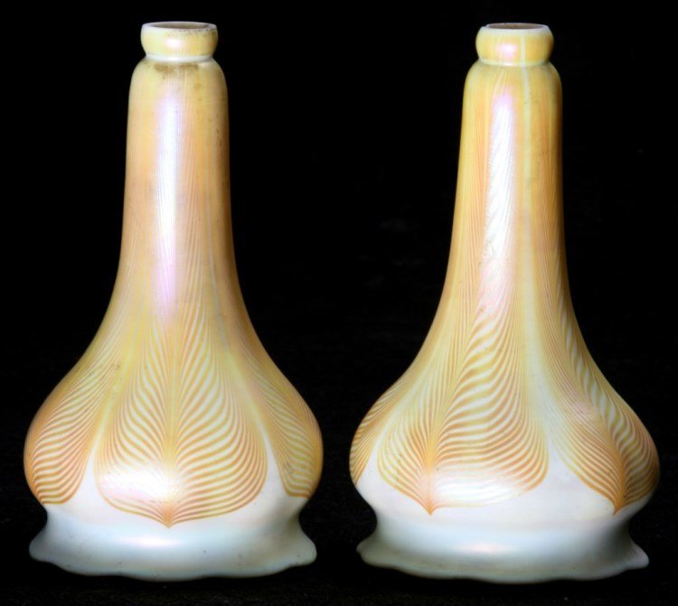 2 Artglass Pulled Feather Floriform Shades: 2 Artglass Pulled Feather Floriform Shades. Shades have a long bottle neck, bulbous form body with pinched and flaring rim with scalloped edge. Has a white opalescent exterior surface with gold pulled