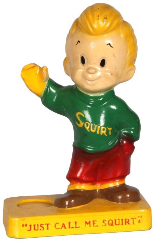 Squirt Soda Figural Advertising Stand: Squirt Soda Figural Advertising Stand. Terra cotta standing caricature figure of a boy with his left hand in his pocket and right hand propped up to hold a soda bottle on the stand. The front of the p