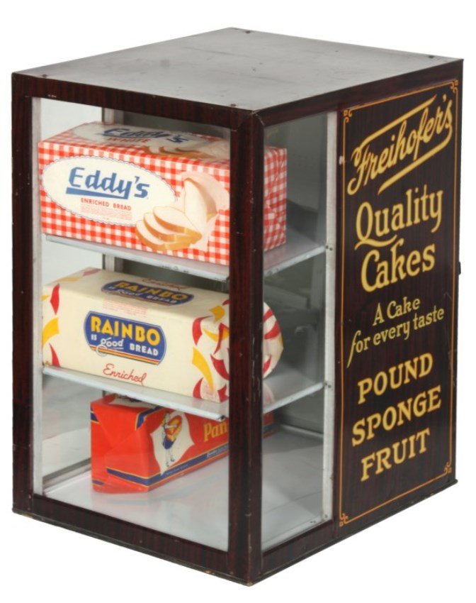 Freihofer’s Store Advertising Bread Display Box: Freihofer’s Store Advertising Bread Display Box. Counter top store advertising tin litho case with wood grain decorated panels, glass front and sides, rear of the sides reads Freihofer’s Quality C