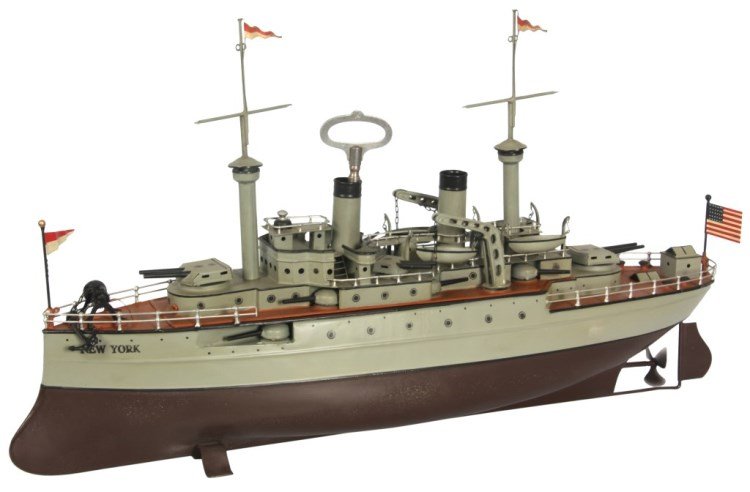 Attr: Carette Windup Battleship Toy: Attr: Carette Windup Battleship Toy. Steam-powered battleship tin toy with working propellers powered by spring driven clockwork mechanism wound through the front steam stack; has gun turrets mounted 