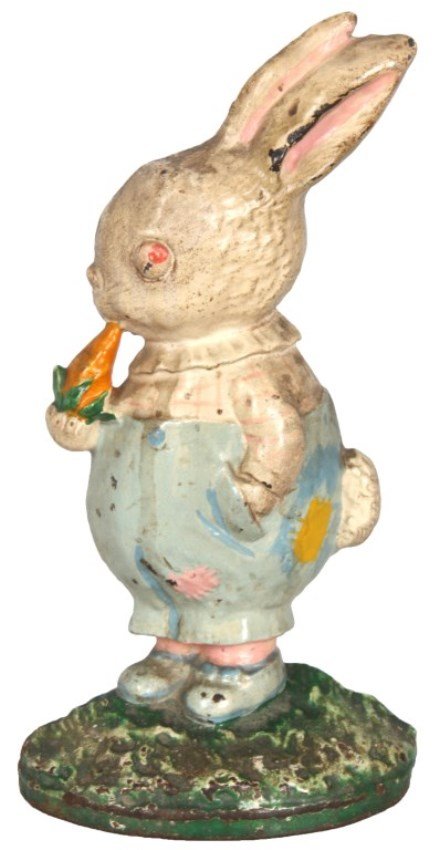 Hubley Peter Rabbit Cast Iron Doorstop: Hubley Mfg. Co. Peter Rabbit Cast Iron Doorstop. Standing rabbit figure looking to his right, wears blue trousers and a white top; he stands with his right hand in his pocket and holds a carrot to his