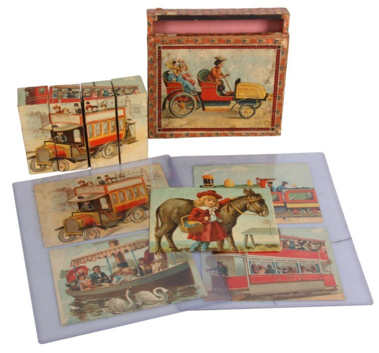 Set of German Puzzle Blocks: Set of German Puzzle Blocks, c.1910. Wood blocks with 6 litho scenes including a pond boat with swans, automobile ride, girl with donkey, double decker tour truck, coal engine train and double decker 